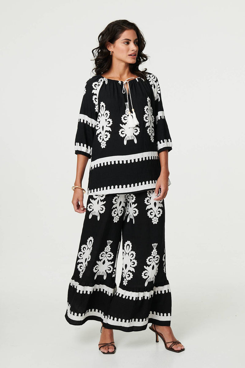 Ikat Print Tassel Tie Neck Blouse
