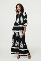 Ikat Print Tassel Tie Neck Blouse