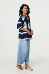 Ikat Print Tassel Tie Neck Blouse