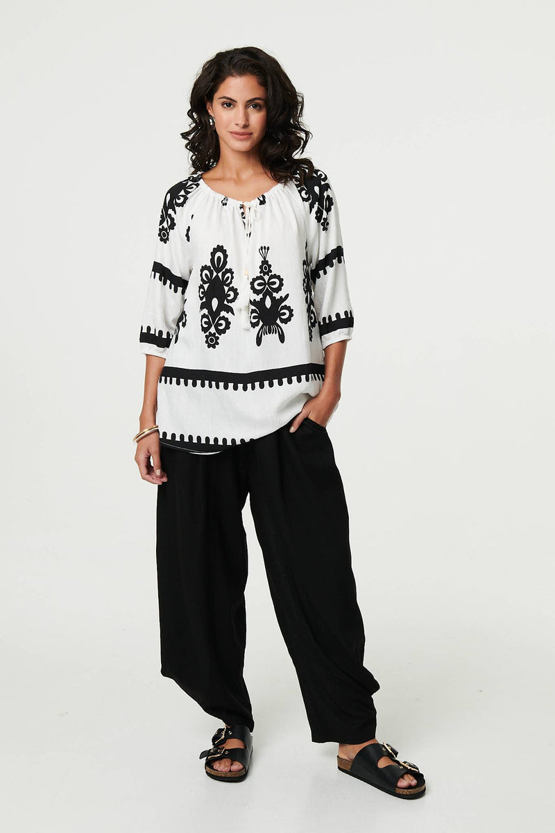 Ikat Print Tassel Tie Neck Blouse