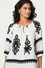 Ikat Print Tassel Tie Neck Blouse