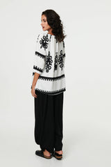 Ikat Print Tassel Tie Neck Blouse